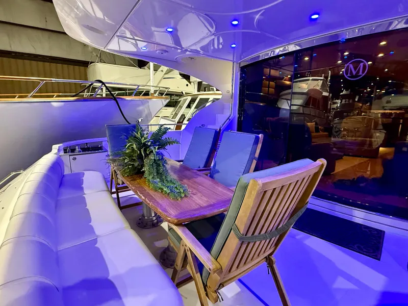 Slide: The Image of Luxurious 2005 Marquis 65 yacht deck with elegant seating and ambient lighting. - 10