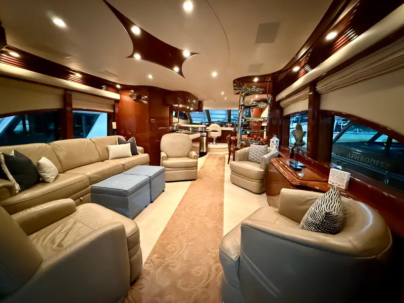 Slide: The Image of Luxurious interior of a 2005 Marquis 65 yacht with elegant seating and ambient lighting. - 14