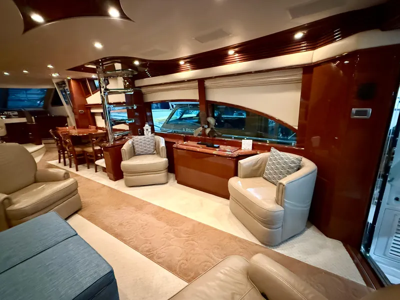 Slide: The Image of Luxurious interior of a 2005 Marquis 65 yacht with elegant seating and wood finishes. - 16