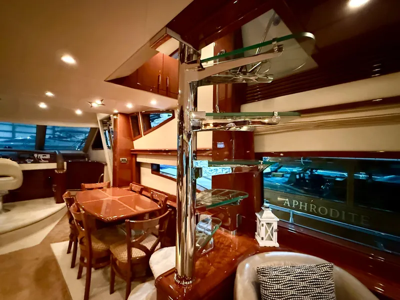 Slide: The Image of Luxurious interior of a 2005 Marquis 65 yacht with elegant dining area and modern design. - 20