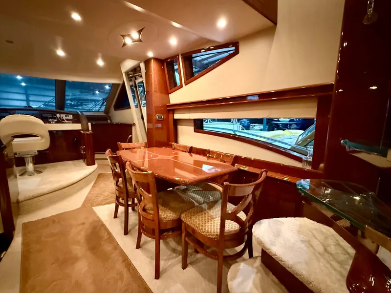 Slide: The Image of Luxurious interior of a 2005 Marquis 65 yacht with elegant dining area. - 23