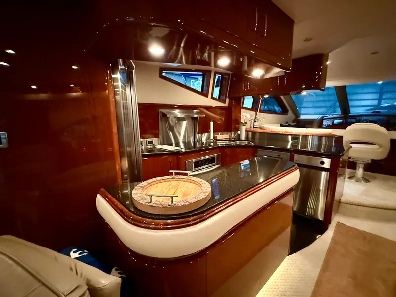 Slide: The Image of Luxurious interior of a 2005 Marquis 65 yacht with modern kitchen amenities. - 24