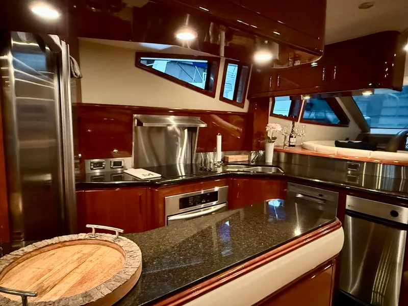 Slide: The Image of Luxurious kitchen interior of a 2005 Marquis 65 yacht with modern appliances. - 28