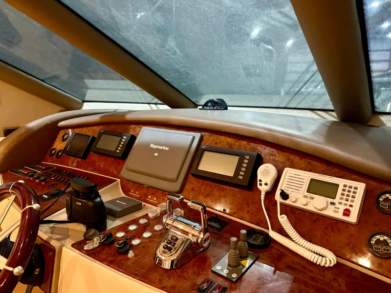 Slide: The Image of Control panel of a 2005 Marquis 65 yacht with navigation and communication equipment. - 35