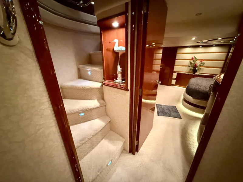 Slide: The Image of Luxurious interior of a 2005 Marquis 65 yacht with elegant stairs and cozy bedroom. - 36