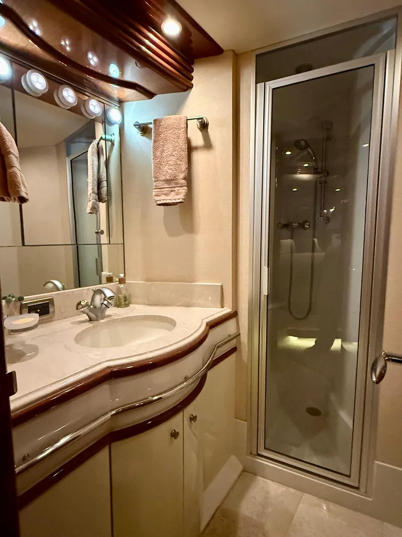 Slide: The Image of Luxurious bathroom in 2005 Marquis 65 yacht with elegant sink and glass shower. - 37