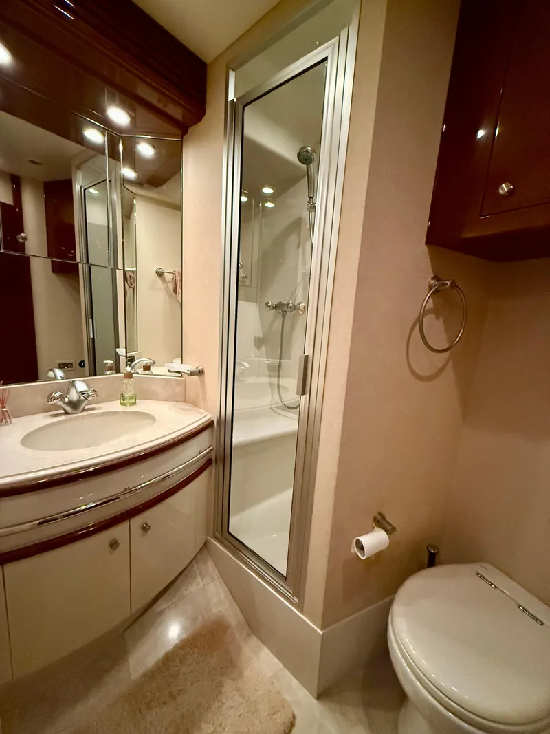 Slide: The Image of Luxurious bathroom in 2005 Marquis 65 yacht with shower, sink, and toilet. - 41