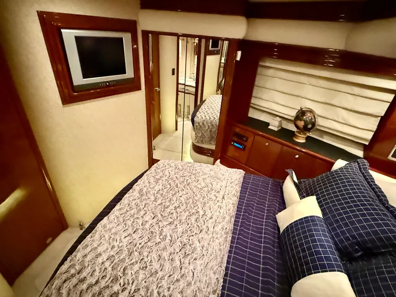 Slide: The Image of Luxurious bedroom interior of 2005 Marquis 65 yacht with elegant bedding and modern decor. - 44