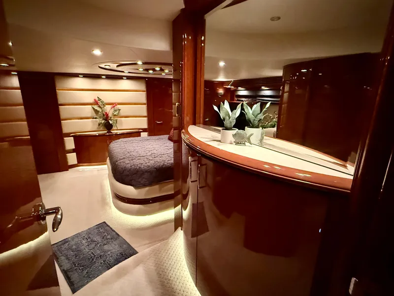 Slide: The Image of Luxurious interior of a 2005 Marquis 65 yacht with elegant wood finishes and ambient lighting. - 46