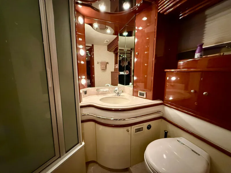 Slide: The Image of Luxurious bathroom in a 2005 Marquis 65 yacht with elegant wood finishes. - 50
