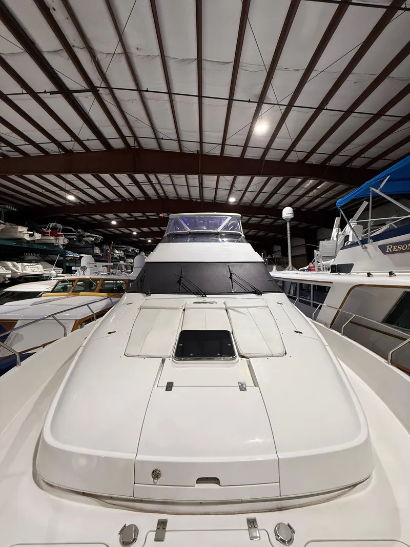 Slide: The Image of 2005 Marquis 65 yacht in storage, showcasing sleek design and spacious deck. - 8