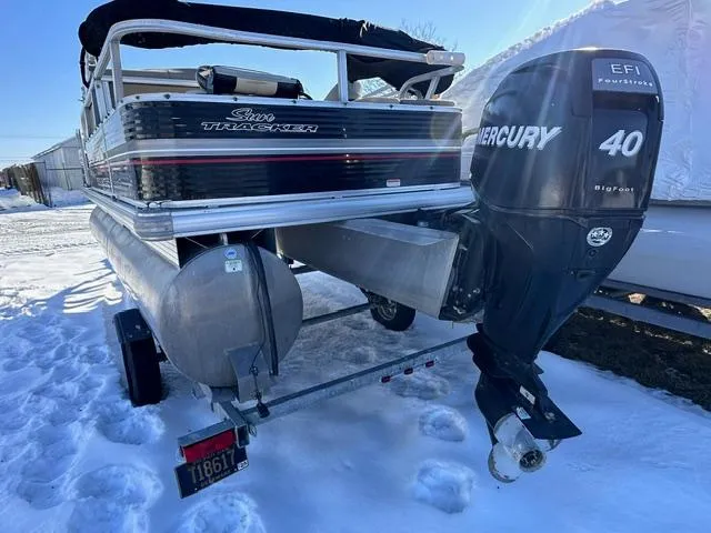 Slide: The Image of 2012 Sun Tracker Bass Buggy 18 DLX with Mercury 40 EFI outboard on snowy ground. - 5