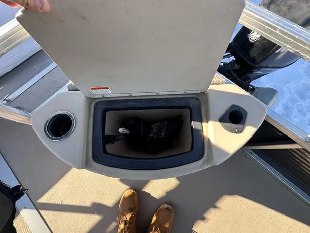 Slide: The Image of Open storage compartment on 2012 Sun Tracker Bass Buggy 18 DLX boat. - 6