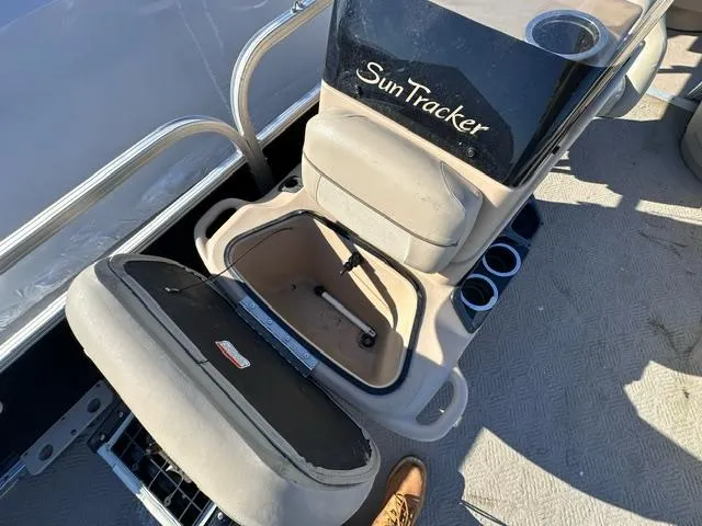 Slide: The Image of 2012 Sun Tracker Bass Buggy 18 DLX boat seat with storage compartment open. - 8