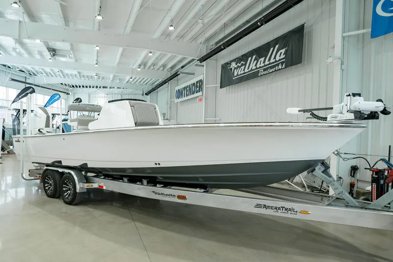 The Image of 2024 Valhalla Boatworks V-28 on trailer in showroom, sleek white design. - 0