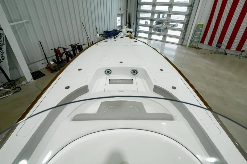Slide: The Image of 2024 Valhalla Boatworks V-28 in a spacious indoor facility, showcasing sleek deck design. - 10