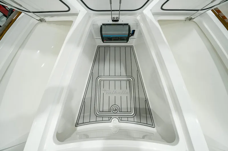 Slide: The Image of 2024 Valhalla Boatworks V-28 interior storage compartment with sleek design and modern features. - 13