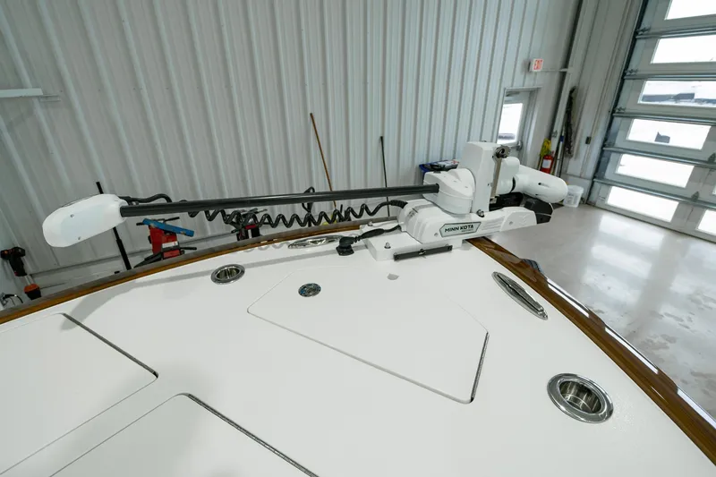 Slide: The Image of 2024 Valhalla Boatworks V-28 with advanced trolling motor in a garage setting. - 16