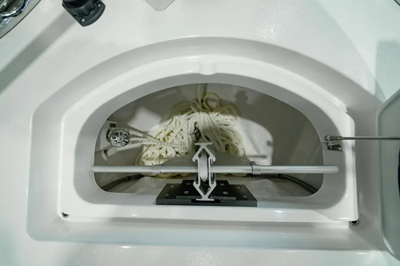 Slide: The Image of 2024 Valhalla Boatworks V-28 anchor storage compartment with rope neatly arranged. - 17