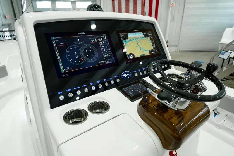 Slide: The Image of 2024 Valhalla Boatworks V-28 dashboard with advanced navigation and control systems. - 20