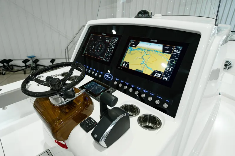 Slide: The Image of 2024 Valhalla Boatworks V-28 helm with advanced navigation displays and controls. - 22