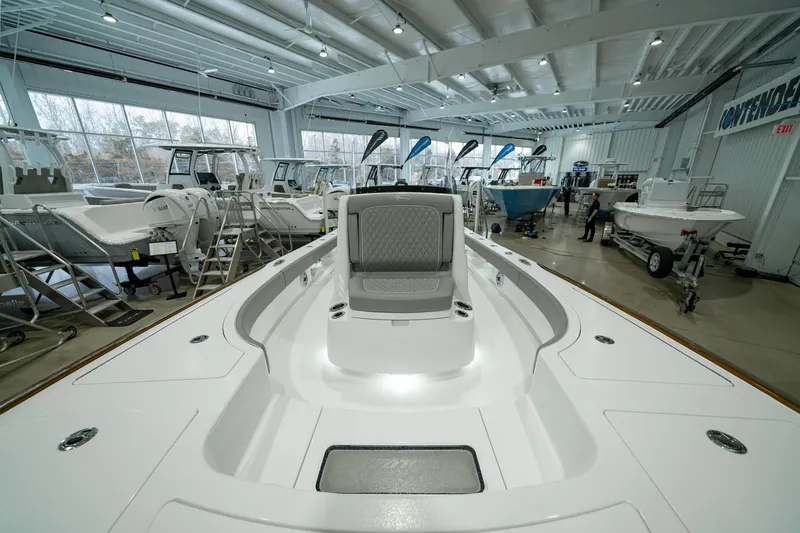 Slide: The Image of 2024 Valhalla Boatworks V-28 in showroom, showcasing sleek design and spacious deck. - 25