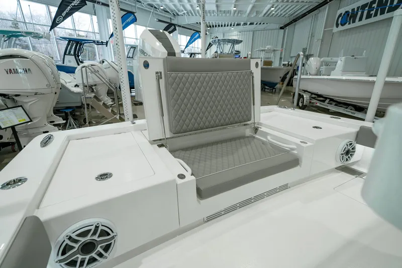 Slide: The Image of 2024 Valhalla Boatworks V-28 interior with cushioned seating and modern design in showroom. - 32