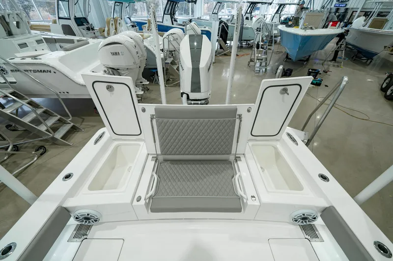 Slide: The Image of 2024 Valhalla Boatworks V-28 interior with seating and storage compartments in a showroom. - 34