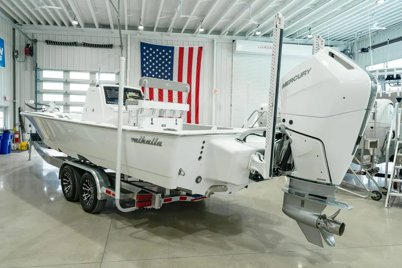 Slide: The Image of 2024 Valhalla Boatworks V-28 with Mercury engine in a showroom. - 4