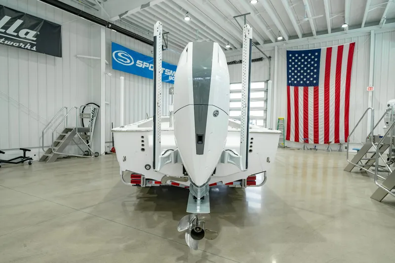 Slide: The Image of 2024 Valhalla Boatworks V-28 in showroom with American flag backdrop. - 6