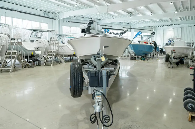 Slide: The Image of 2024 Valhalla Boatworks V-28 in showroom, front view, on trailer. - 7