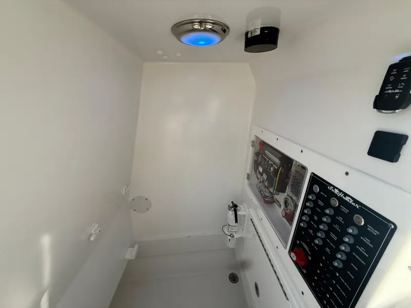 Slide: The Image of 2024 SeaHunter 28 Floridian interior with control panel and lighting. - 10