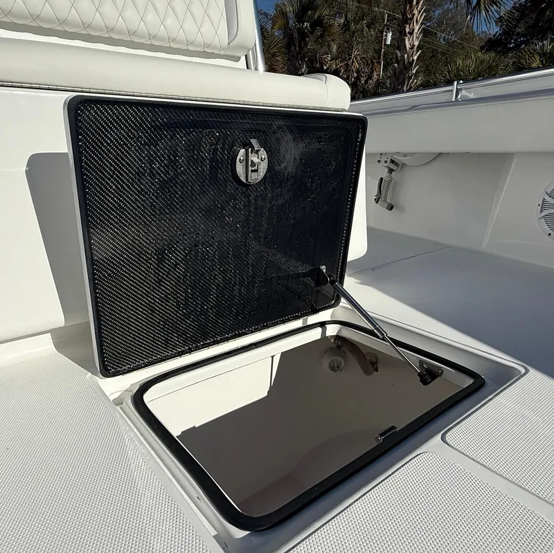 Slide: The Image of 2024 SeaHunter 28 Floridian boat storage compartment with open hatch. - 18