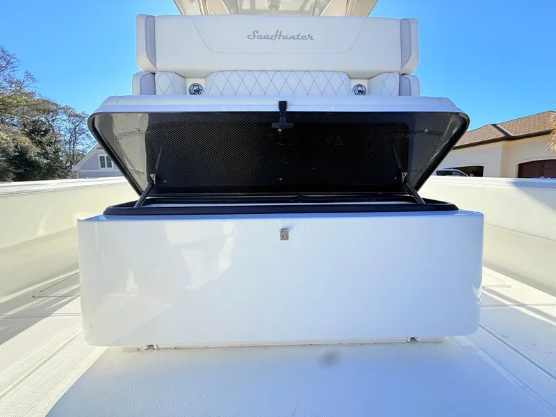 Slide: The Image of 2024 SeaHunter 28 Floridian boat with open storage compartment. - 19