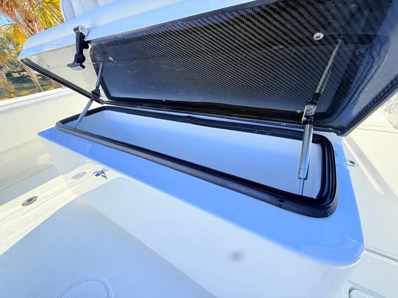 Slide: The Image of 2024 SeaHunter 28 Floridian boat storage compartment with open lid. - 20