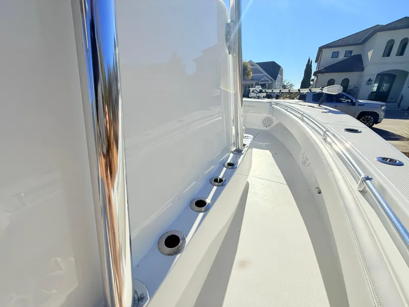 Slide: The Image of 2024 SeaHunter 28 Floridian boat deck with rod holders and sleek design. - 26
