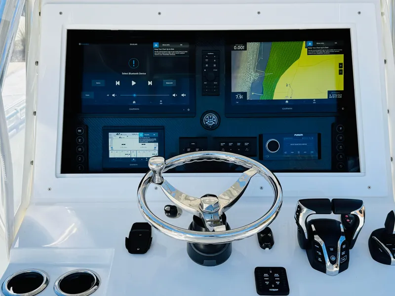 Slide: The Image of 2024 SeaHunter 28 Floridian dashboard with advanced navigation and control systems. - 5