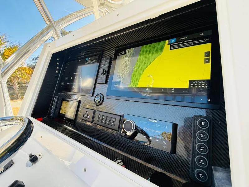 Slide: The Image of 2024 SeaHunter 28 Floridian dashboard with advanced navigation and control systems. - 6