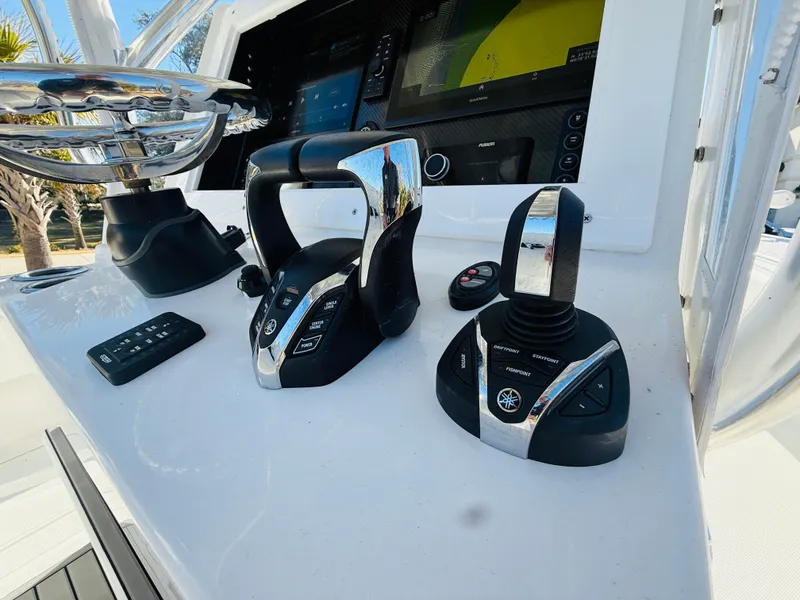 Slide: The Image of Control panel of 2024 SeaHunter 28 Floridian boat with advanced navigation equipment. - 8