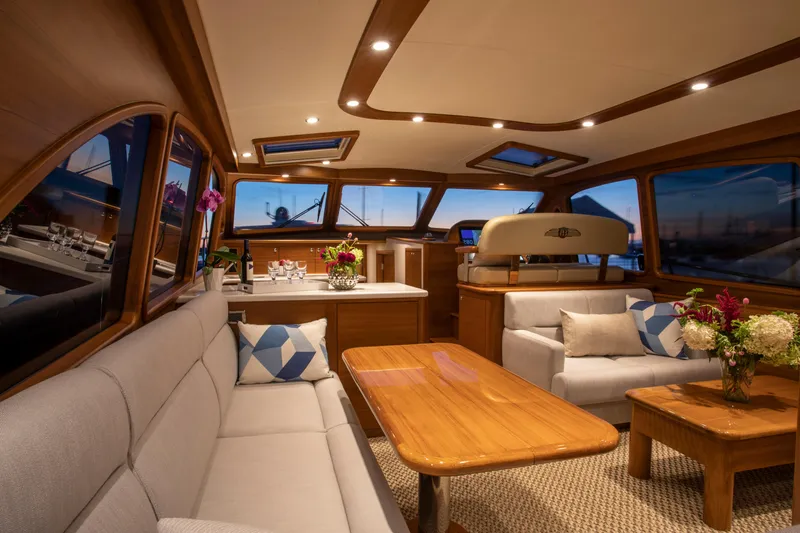 Slide: The Image of Luxurious interior of 2026 Palm Beach Motor Yachts PB55 with elegant seating and wooden accents. - 7