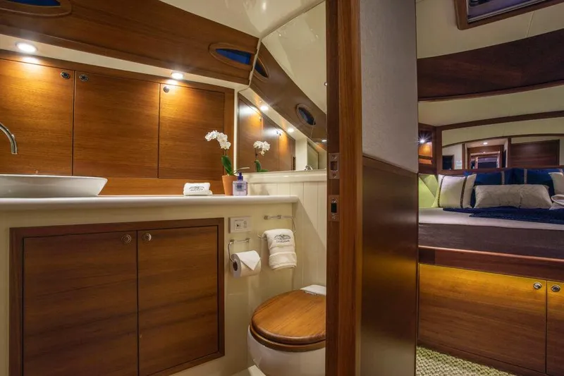 Slide: The Image of Luxurious 2026 Palm Beach Motor Yachts PB55 interior with elegant wood finish and modern amenities. - 10