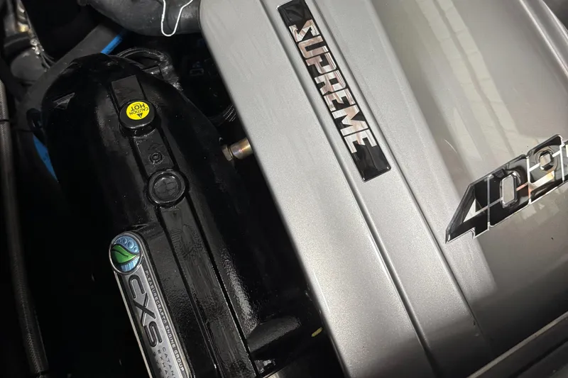 Slide: The Image of Close-up of a 2025 Supreme S220 engine with CXS and 409 branding. - 20