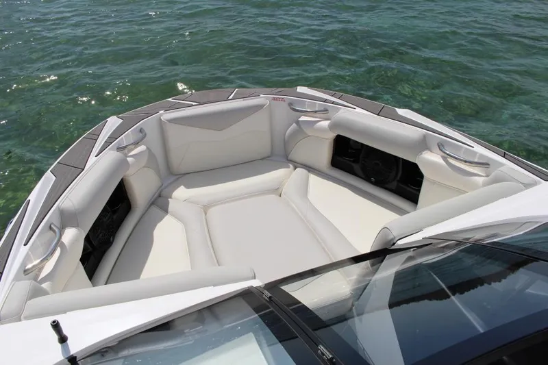 Slide: The Image of Bow seating area of 2025 Supreme S220 boat on clear water. - 4