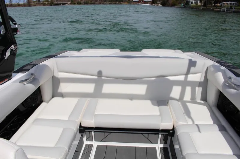 Slide: The Image of Luxurious seating on 2025 Supreme S220 boat, overlooking serene lake waters. - 6