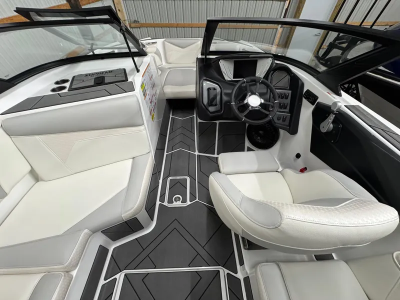 Slide: The Image of 2025 Supreme S220 boat interior with modern design and luxurious white seating. - 9
