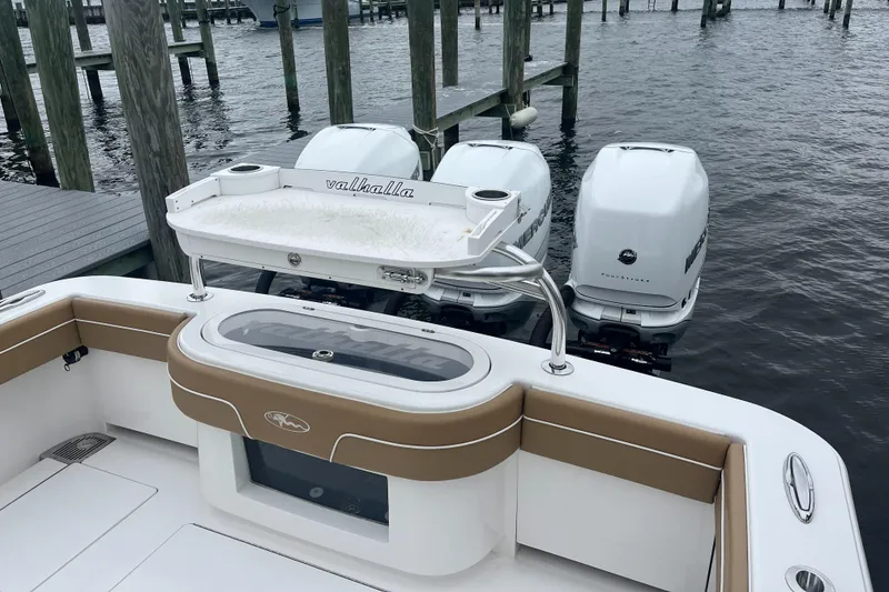 Slide: The Image of 2023 Valhalla Boatworks V-37 with triple outboard engines docked at marina. - 16
