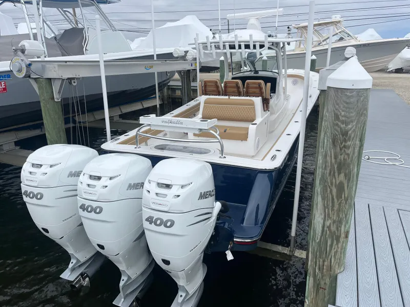 Slide: The Image of 2023 Valhalla Boatworks V-37 with triple Mercury 400 engines docked at marina. - 3