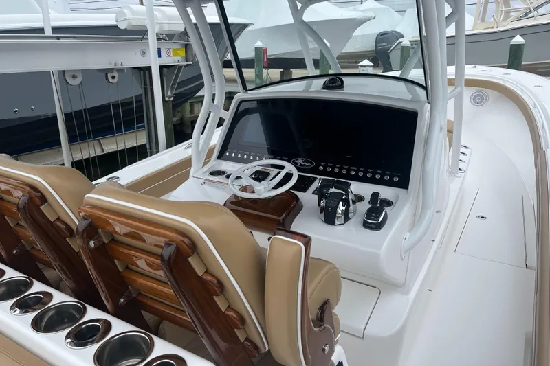 Slide: The Image of 2023 Valhalla Boatworks V-37 helm with modern controls and dual seating. - 4
