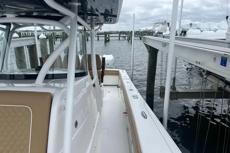 Slide: The Image of 2023 Valhalla Boatworks V-37 docked at marina, showcasing sleek design and spacious deck. - 9