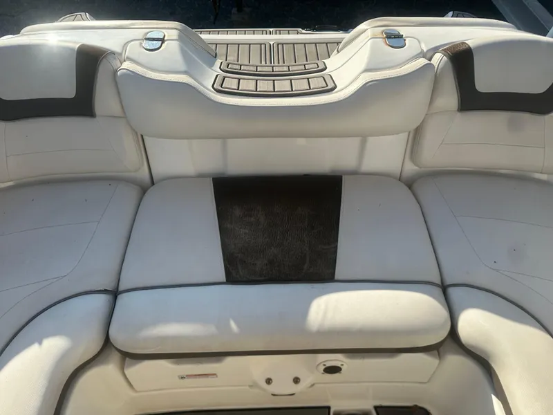 Slide: The Image of 2013 Yamaha Boats SX192 interior seating, white upholstery, rear view. - 16